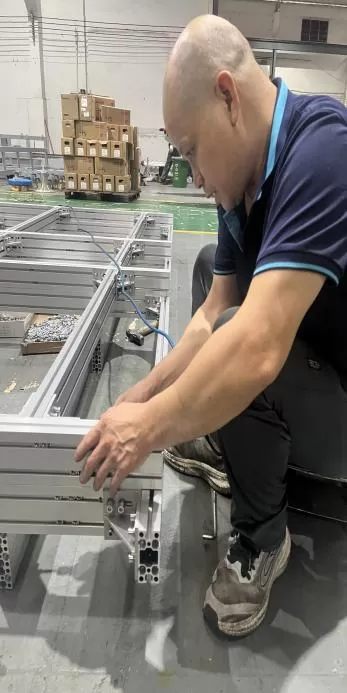 a worker is tightening screws a worker is tightening screws